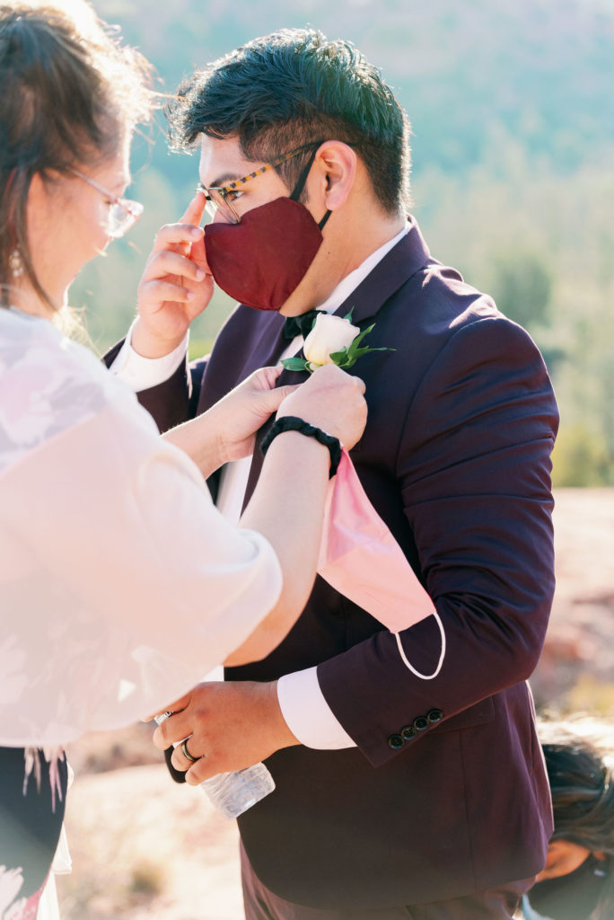 Groom in Sedona arizona Elopement on top of mountain Cathedral Rock during covid 