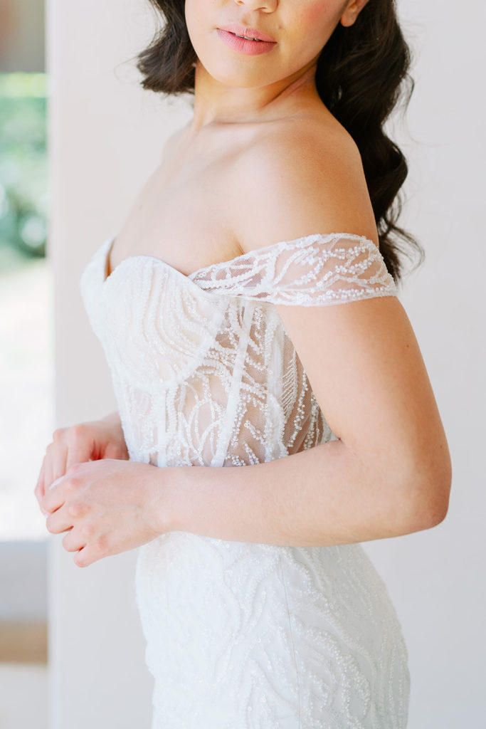 white off the shoulder beaded wedding gown 