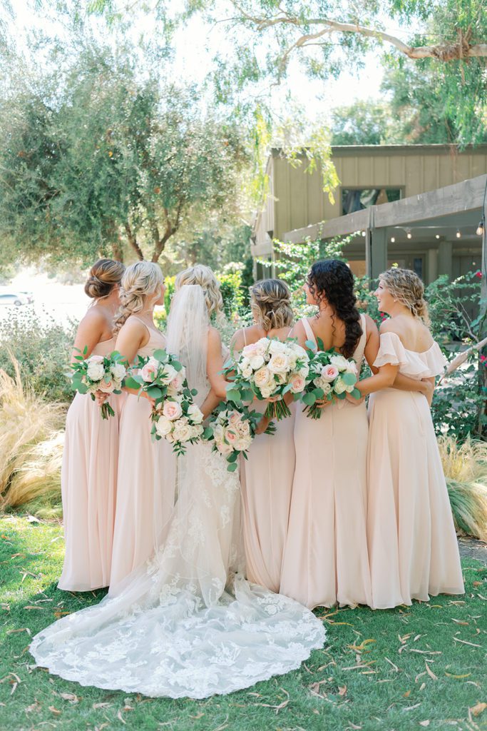 bride and bridesmaids in blush dresses 