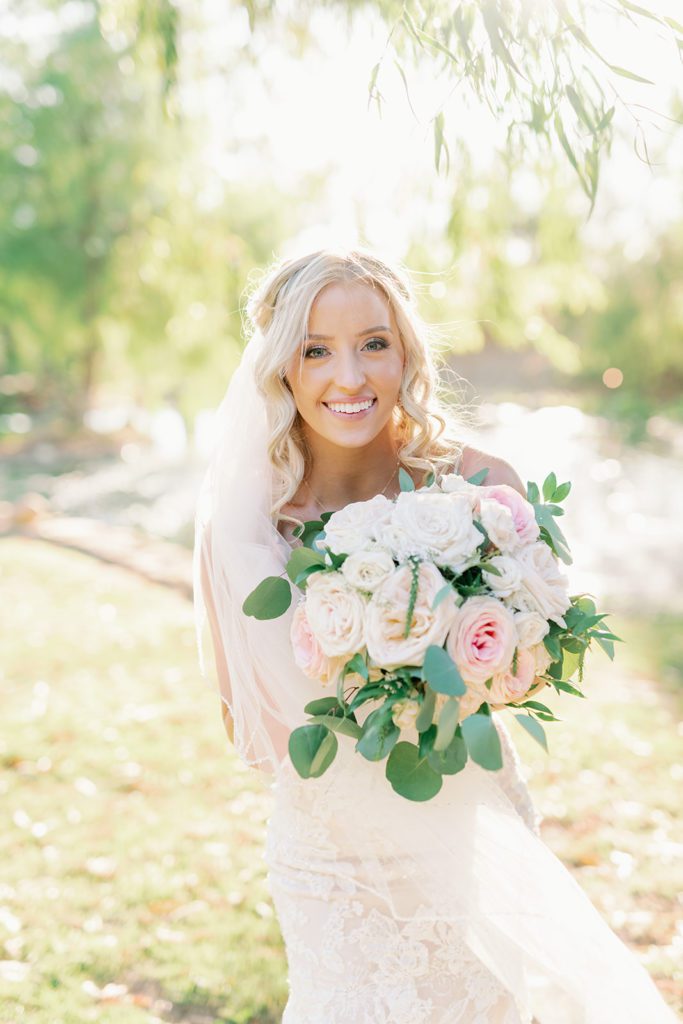 bride with pink and white flowers 