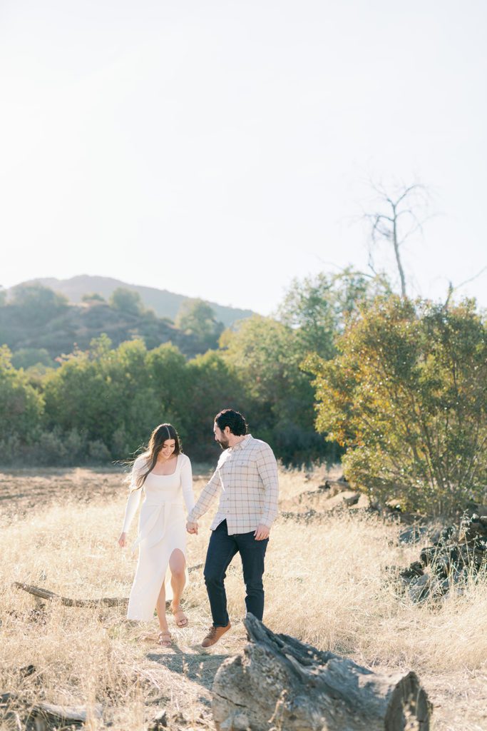 couple engagement photos with bright colorful editing style Temecula California, couple walking in field