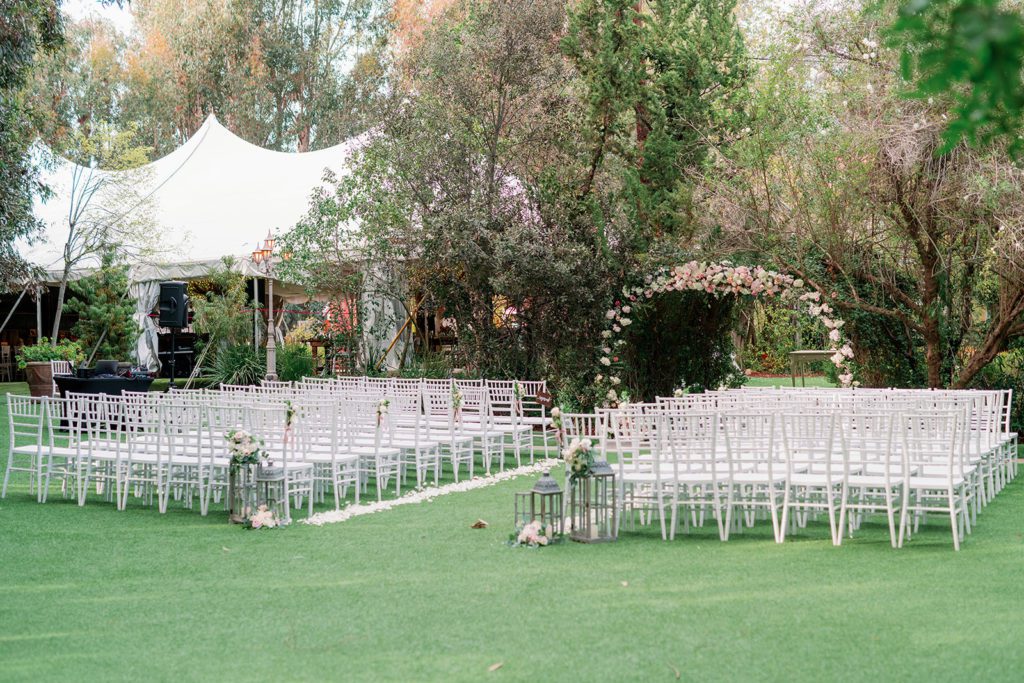 Twin Oaks Gardens Wedding ceremony with flower arch 