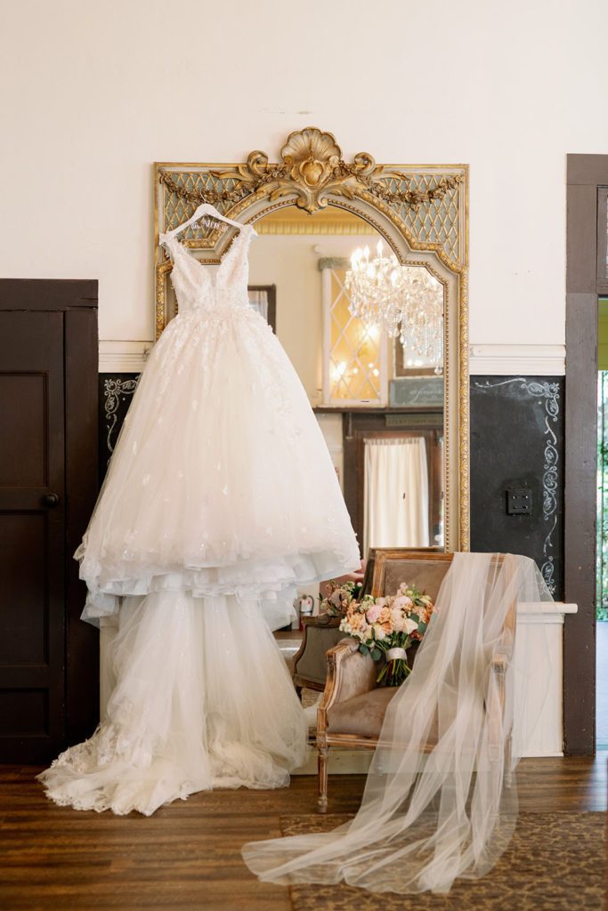 dress hanging from mirror with vail twin oaks 